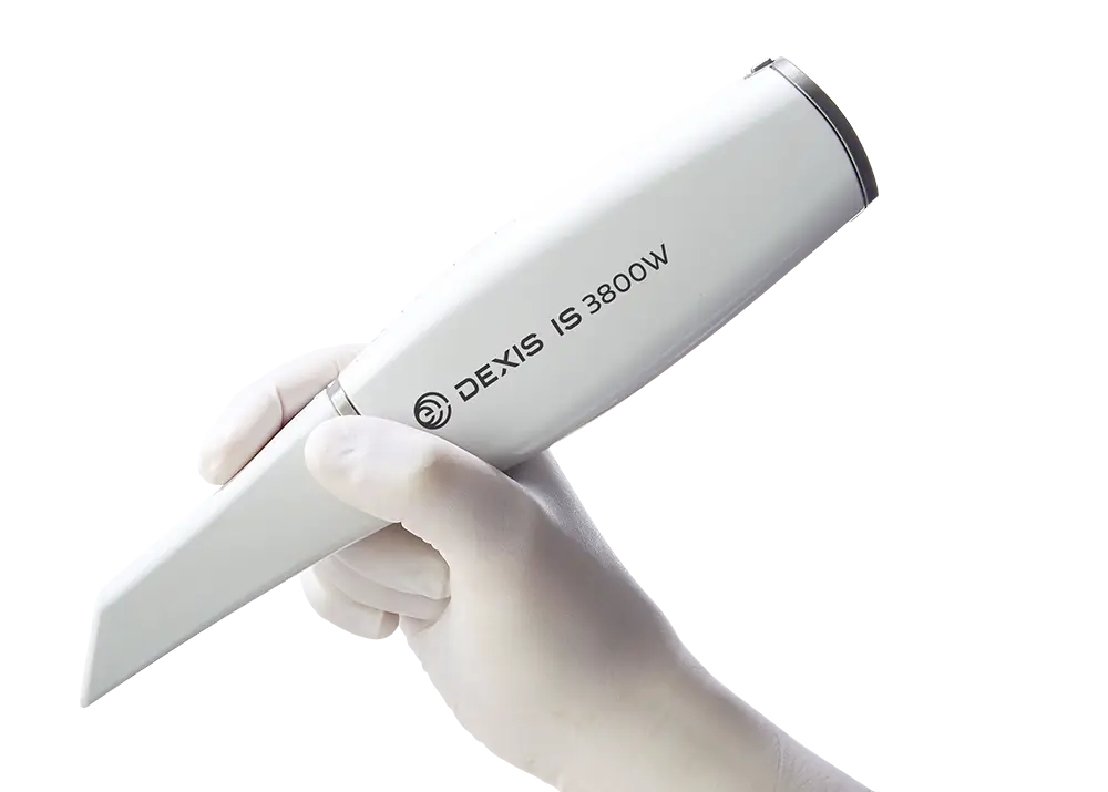 DEXIS IS 3800W wireless intraoral scanner held in a gloved hand
