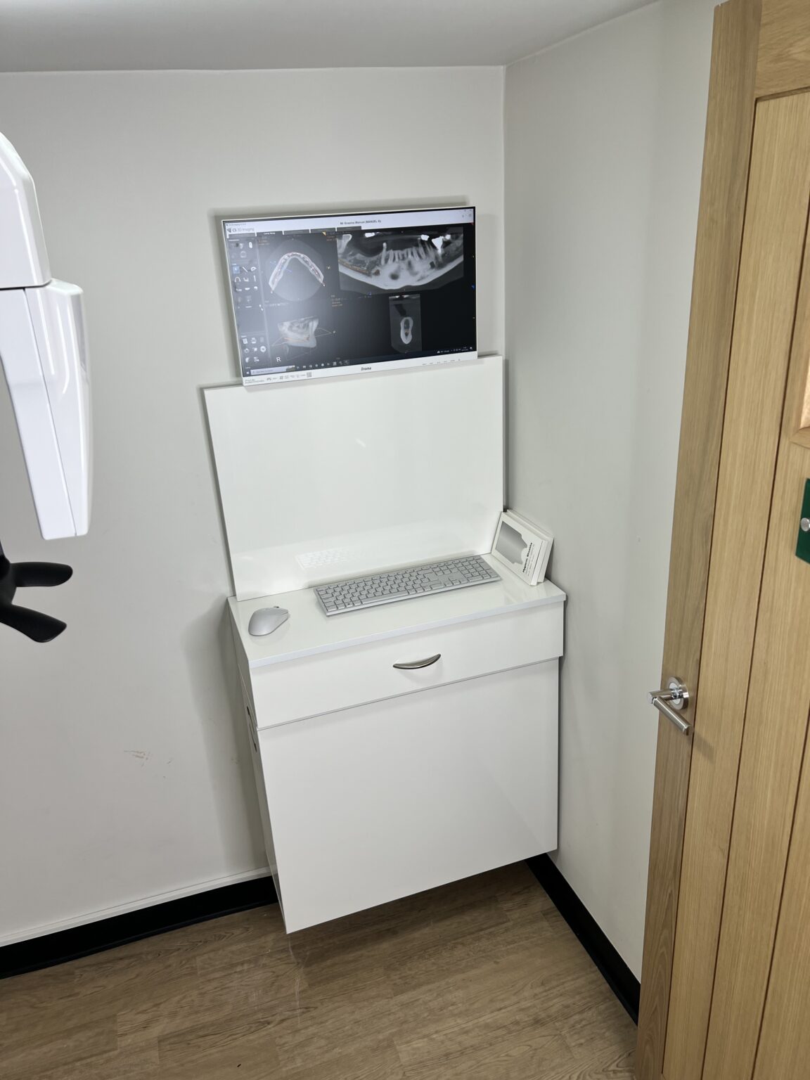 Wall-mounted review screen in the CBCT room at Dentistry at Holme