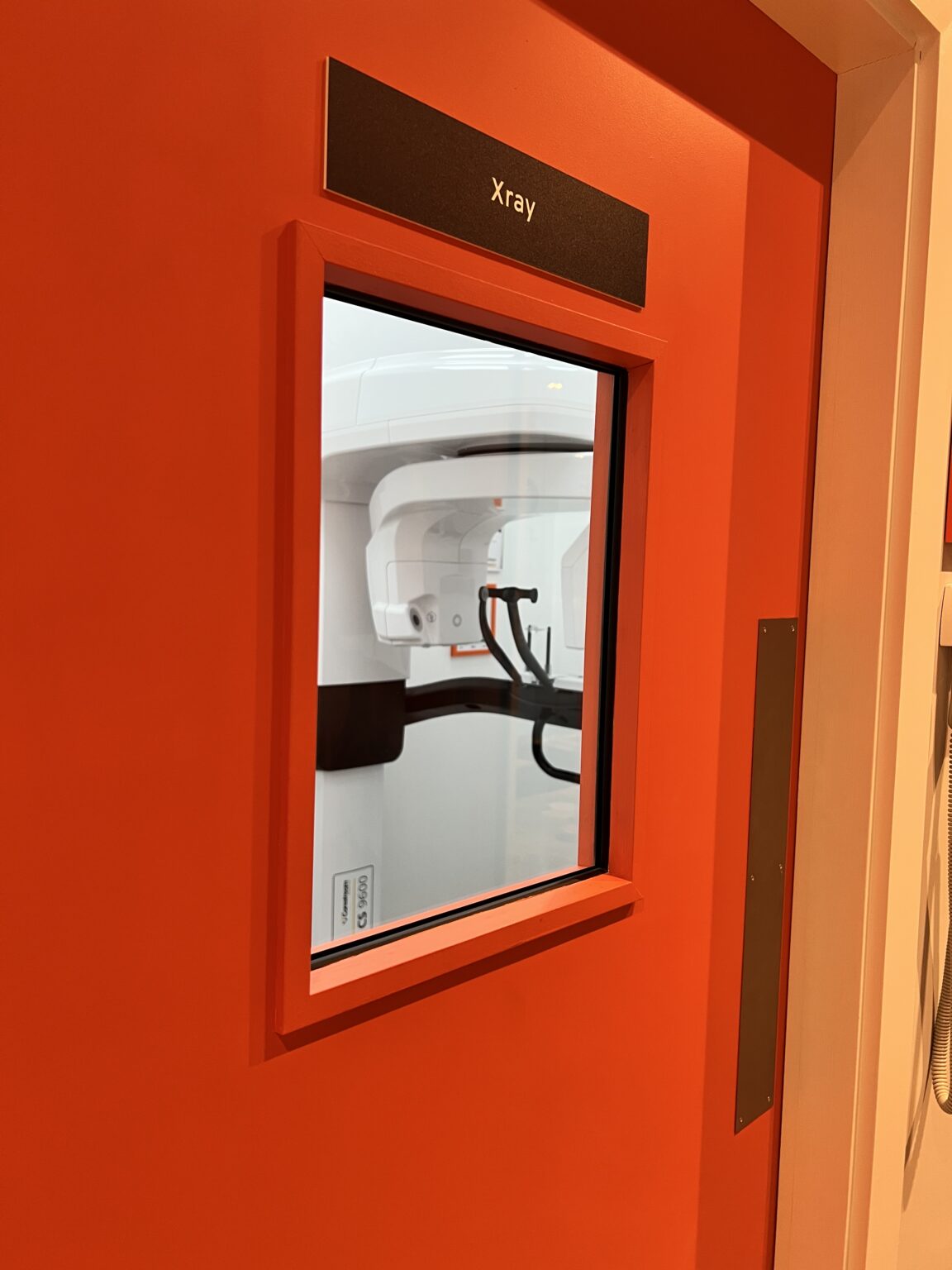 Leaded X-ray door with viewing window at Evo Dental, looking in on the Carestream CS 9600