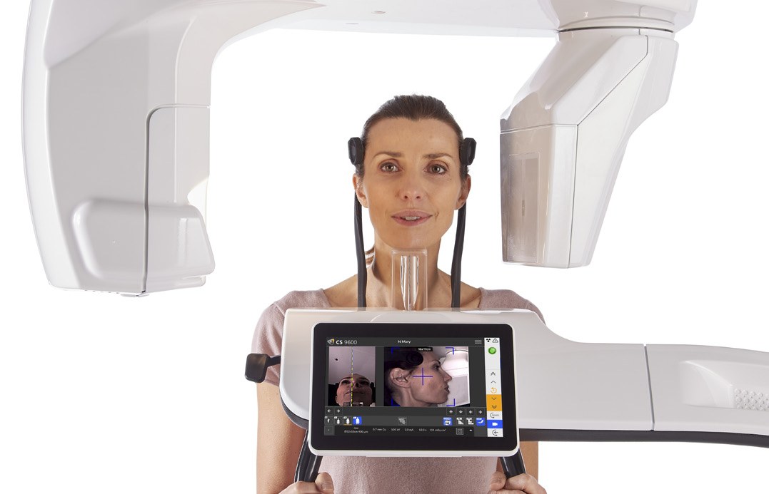 Operator positioning a patient in the Carestream CS 9600 using the live camera view on the touch screen